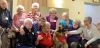 Participants in the Adult Day Program at the Grace Hall surrounding Copper, and Trina Mawer