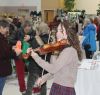 Wandering minstrel Jessica Wedden provided entertainment with her fiddle while a myriad of shoppers filled the gym at the Harrowsmith Free Methodist Church Saturday. Photo/Craig Bakay