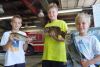 young fishers Cole, Riley and Kyler participated in this year&#039;s Portland and District Firefighters&#039; Bass Derby and weighed in their catches at the Hartington fire station on July 5