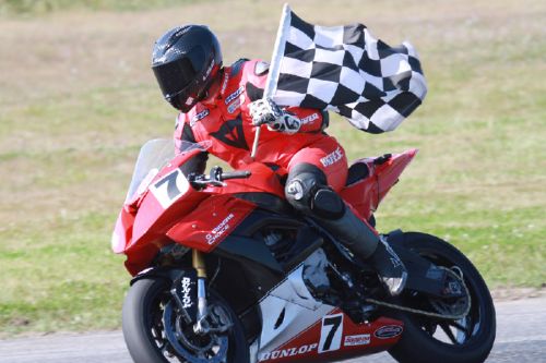 Inverary’s Jeff Williams takes the checkered flag at a recent CSBK event. Photo/Don Empey.
