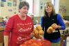 Linda Bates and Sue Clinton adding fresh vegetables to the South Frontenac Christmas baskets.