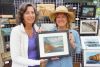 Christine Post (left) purchased Lisa Johnson&#039;s (right) painting titled Rekr&#039;s Rock at the Bon Echo Art Exhibition and Sale