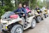 Adam and Beverly Bulman of Bailieboro, Jason Bulman of Peterborough and Roger Rocha of Ottawa proudly display their muddy machines after completing the annual spring ATV run in Ompah Saturday. Photo/Craig Bakay