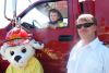 Sparky with three-year-old Christopher Perry and Fire Chief Casey Cuddy at Flinton&#039;s Touch a Truck event on June13.