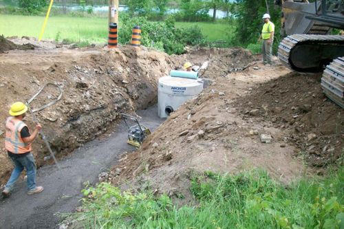 Road crews working on a fix for the sinkhole tht swallowed part Sydenham this spring