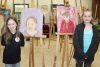 Denver Arrey and Rachel Gray with their self-portraits at the LOLPS art club show last Wednesday in Mountain Grove. Photo/Craig Bakay