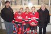 Atom Girls Frontenac Fury coach Jason Norman with cousins and players, Taylor, Sophie and Jenna and their great grandmother Barb Stewart following their exhibition game against the Kingston Ice Wolves (blues)