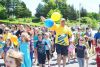 Doug McIntyre (in yellow – forefront) and Joyce Dendy (on the left) were surrounded by students as they completed the Survivors’ lap at the PCPS Relay for Life.