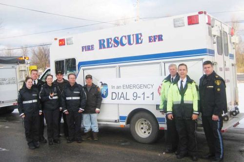 Fire crews and paramedics celebrating the 9-1-1 service in 2004