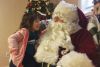 Olivia Webster visting with Santa at the S&amp;A Club