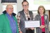 Coun. Gerry Martin and John Inglis presented Brenda Martin of the Clar-Miller Community Archives with a cheque for $6,650 from the Community Foundation for Kingston &amp; Area to undertake the project Unravelling History: One Tombstone at a Time. The funds will be used to hire a summer student, Martin said. Photo/Craig Bakay