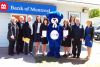 (l-r) Chris Langevin, Bill Cox, Fred Perry, Jen Baker, Sandra Henderson, BMO the Bear, Danielle Williams, Cythia Surette, Henry Hogg, and Esther Denczak at BMO Northbrook&#039;s special 50th year celebrations that took place at the branch on May 20.