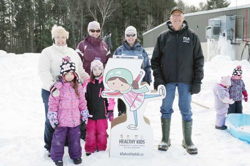 County Warden and acting champion of the KFL&A's Healthy Kids Community Challenge, Frances Smith, with South Frontenac Mayor Ron Vandewal and participants at the Family Day in the Frontenacs event at the Frontenac Community Arena in Piccadilly. Courtesy Paul Walsh.