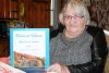 Marion Sly Hart with her new book, Hart to Heart, My Life in Poems as well as her mother’s apron, a symbol of both grief . . . and comfort to her.