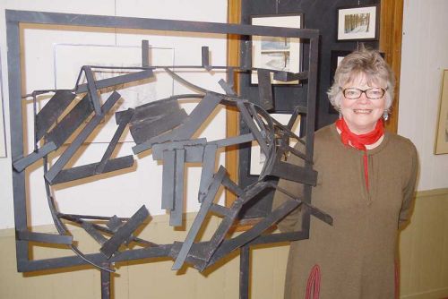 Multi-media artist Elizabeth Veninga and her sculpture titled “Rock Face” at the MERA Schoolhouse