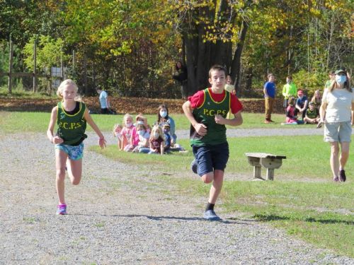 Prince Charles PS students Allie and Jon run the cross country course.