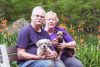 Bill and Linda Zwier along with their pups Poppy and DaisyMae in their garden near Mountain Grove. Photo/Craig Bakay