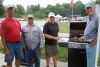 Arden seniors Lorne Hiltz, David Neil, Doug Smith and Peter Smiley serve up burgers for visitors at the Arden Seniors Happy Gang&#039;s annual summer fundraiser at the Kennebec hall on July 26