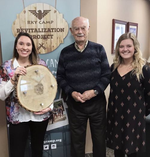 Former RKY staffers Katie Peruniak and Emma Langlois pre- sented a plaque to Brit Smith in 2017