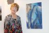 Louise Day with three of her otherworldly photographs of frost in the gallery at Blueroof Farm. Photo/Craig Bakay