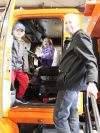 Touch the Truck is designed as a way for parents and grandparents to get out and do something with their little ones and South Frontenac Mayor Ron Vandewal was on board with that, attending with grandchildren Alexis and Brooks Vandewal (pictured) and Abby Reynolds. Photo/Craig Bakay