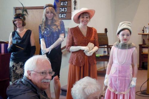 models sport vintage clothing from the 1930's at the Harrowsmith Womens Institute’s fashion show/fundraiser for New Leaf Link