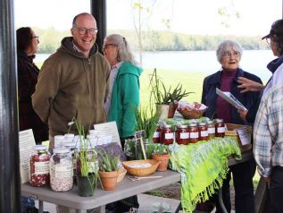 Isaac Hale of Learning Curve in Arden was all smiles as the Sharbot Lake Farmers Market opened for the season Saturday. Photo/Craig Bakay (note this cut line has been corrected)
