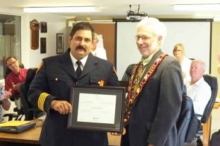  Randy Schonauer, a firefighter with Clarendon Miller, was presented with the Fire Services Exemplary Service Medal by Mayor Ron Higgins on Friday for his 20 years of service with the volunteer fire department.