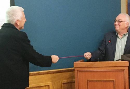 Mayor Vandewal and Deputy Mayor Leonard exchange a COVID-19 handshake