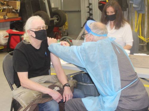 Our intrepid reporter takes one (covid shot) for the team from Dr. Peter Bell at the Sharbot Lake Fire Hall Monday.