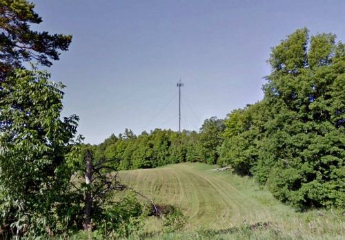 Photo taken from a location near the proposed tower, with a facsimile of a tower projected in the location where it is slated to be located. This is one of the documents that was not included in the original CRINS-SINRC information package and was released when requested.