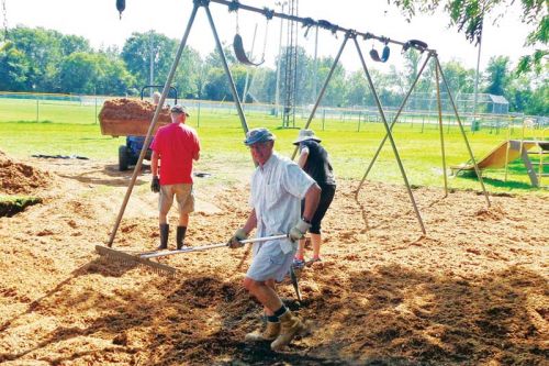 Volunteers working on the playground