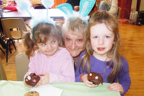 Nevaeh and Riley with Wanda Harrison, chair of the Kennebec Recreation Committee, the latter of whom was all ears at the Annual Kids Easter party that took place at the Kennebec hall in Arden on April 4