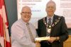 Wayne Orr receiving his nameplate from Mayor Ron Vandewal