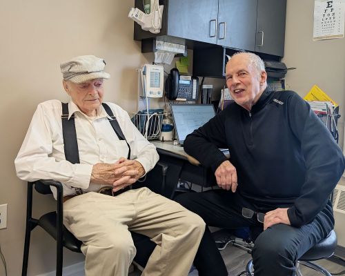 Dr. Peter Bell with his last patient, 92 year old story teller Dave Dawson