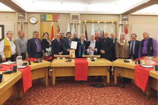 Algonquin Nation Representatives from some of nine communities and members of the Pikwakanagan Council at the signing ceremony in Ottawa. Kirby Whiteduck is holding the signed agreement in principle. Photo courtesy of Indigenous and Northern Affairs Canada.