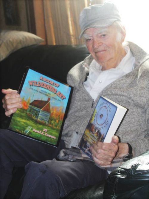 Author/artist/musician/curmudgeon Dave Dawson with his two latest books. Photo/Craig Bakay