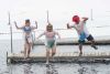 Andrea and Martha MacLeod and Gerald Daviau plunge Scottish style and took home the best costumes award at the 6th annual FHF Polar Bear Plunge