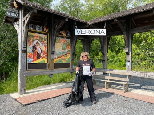 Melissa Elliott of the Verona ATV Club cleaning at the trailhead in Verona