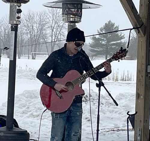 Lucas Pell performs at Harrowsmiths's Centennial Park