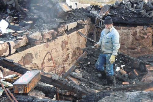 Buck Tibbitt surveys the remains of his home