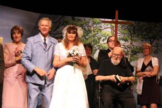 Kathy Magnusson, Brian Robertson, Margo McCullough (behind with cross), Tom Christenson (seated) and Sandy Robertson filling in for Carol Raymo in The Wedding.
