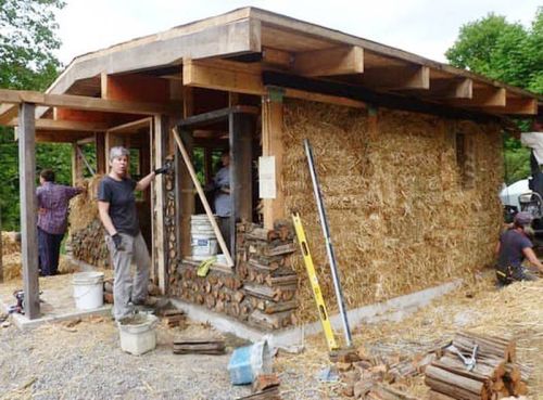 The original straw building during construction.