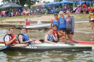 the paddlers and coaches of the small but mighty Sydenham Lake Canoe Club, l-r, George Willes, Matt and Nic Symons, Sebastien L'Abbe, Ian Ramzy with their coaches Rhiannon Murphy and Cia Myles-Gonzalez at the Eastern Ontario Division Championships, which took place in Sydenham on August 8 and 9.