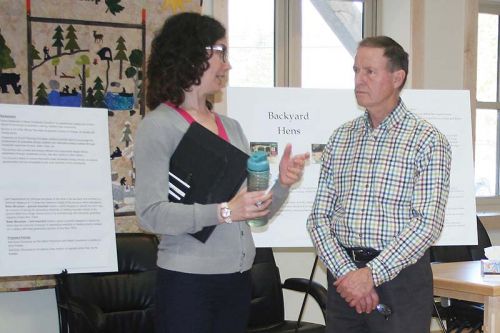 Planner Tracy Zander and Coun. John Inglis discuss North Frontenac’s proposed new Zoning Bylaw at an open house in the Council chambers Saturday in Plevna.