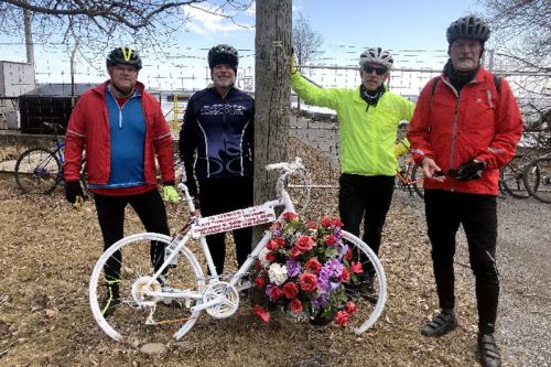 Doug Kennedy (left) with members of his riding club at 'the ghost bike' memorial for 'wheelman' Jeff Vervaike