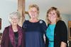 Jean Freeman, Cindy McMahon and Kris Caird stand under the arch, which was a new addition this year, during the 101 Nativities celebration at Cole Lake Free Methodist Church.