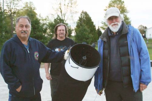 Gary Coleman, Tim Trentadue and Guy Nason set up their telescopes for the North Frontenac Dark Skies Preserve’s first event of their 2017 summer stargazing season. Photo/Craig Bakay