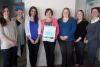staff at the Sharbot Lake Family Health Team l-r Liz Bigelow, Laura Baldwin, Salam Iqbal, Brenda Bonner, Ashley Klatt and Robyn Tatton with Darlene Johnson of KLF&amp;A Public Health are recognized for the success of the 18 Month Well Baby Visit program
