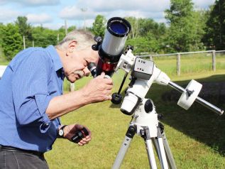 Fred Barrett wanted to give visitors a good look at the Sun Saturday. Unfortunately, the clouds got in the way.